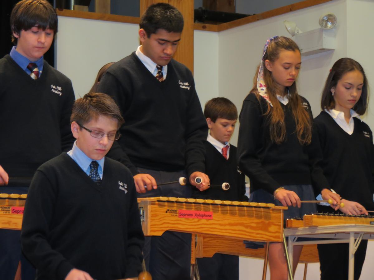 Students playing instruments during an Oak Hill Academy music ensemble 