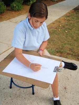 Female student drawing outside on our well-known Lincroft NJ campus